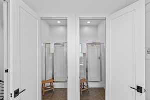 Spacious closet featuring dark tile patterned flooring