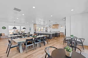 Dining room featuring light wood finished floors and recessed lighting