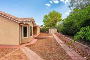 View of yard featuring a storage shed
