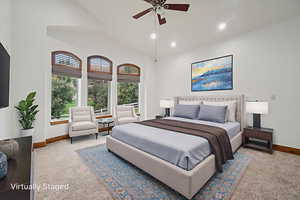 Bedroom featuring recessed lighting, vaulted ceiling, light carpet, and a ceiling fan