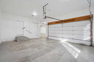 Garage featuring a garage door opener