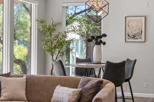 Dining space featuring wood finished floors and baseboards
