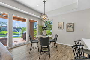 Dining area featuring light wood-style floors and recessed lighting