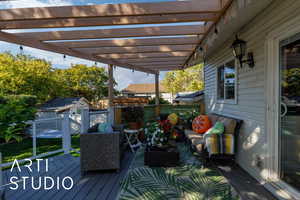 Deck featuring a storage shed and an outdoor hangout area