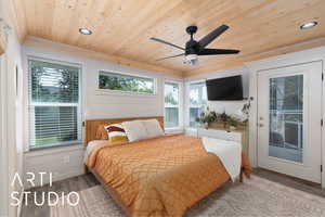 Bedroom with multiple windows, light wood-type flooring, wooden ceiling, access to outside, and recessed lighting