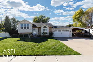 Split level home featuring brick siding, driveway, roof with shingles, a carport, and an attached garage