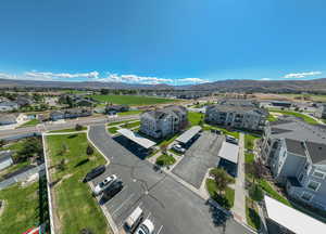 Aerial view of residential area featuring a mountainous background