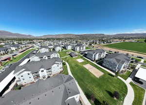 Aerial view of residential area featuring a mountainous background