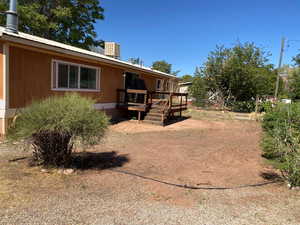 View of yard with a deck