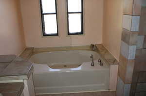 Full bathroom with a bath
