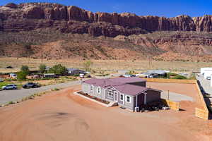 Aerial view of house with Moab Rim