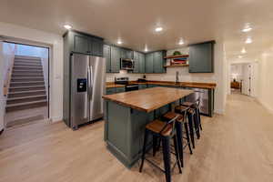 Downstairs entrance + kitchen with custom cabinets