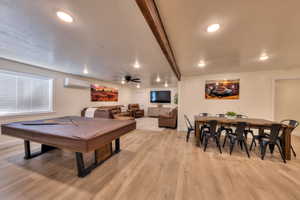 Downstairs dining, living room, and pool table