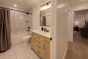 Downstairs bathroom #2 with full tub/shower and beautiful finishes. Laundry room is attached.