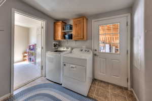 Laundry room with door to garage