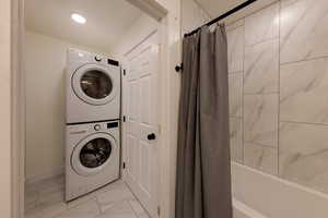 Downstairs laundry room with brand new washer and dryer.