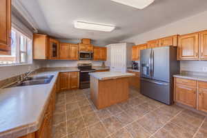 Upstairs kitchen with tons of cabinets and slate appliances