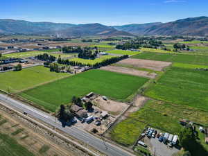 Overview of rural landscape with mountains and rows of crops