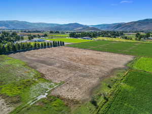 View of mountain backdrop featuring rural landscape