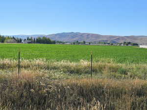 View of mountain background featuring rural landscape