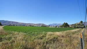 View of mountain backdrop with rural landscape