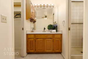 Bathroom with vanity and a shower stall