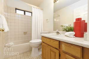 Full bathroom featuring vanity and shower / bath combination with curtain