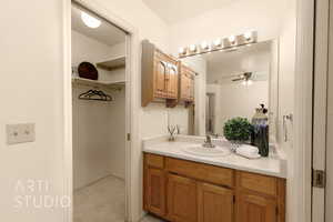 Bathroom with vanity and a ceiling fan