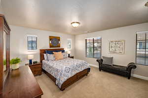 Bedroom 2 with carpet flooring and baseboards