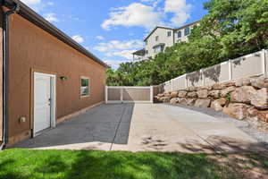 View of patio with a gate