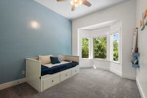 Bedroom with carpet flooring and ceiling fan
