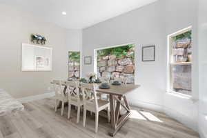 Dining space featuring light wood-style floors and recessed lighting