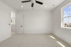 Unfurnished room with light carpet, a ceiling fan, and recessed lighting