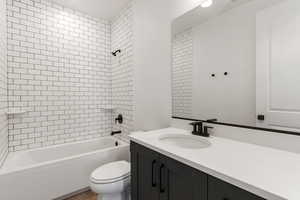 Full bathroom with bathtub / shower combination and vanity