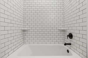 Bathroom featuring bathing tub / shower combination