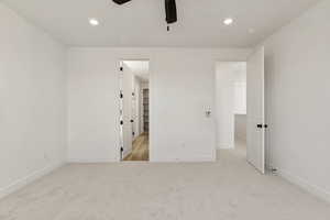 Unfurnished bedroom featuring light carpet, recessed lighting, and ceiling fan