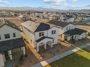 Aerial perspective of suburban area featuring a mountain backdrop