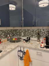 Kitchen view of backsplash and light stone countertops