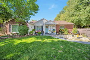 Ranch-style home with brick siding and a chimney