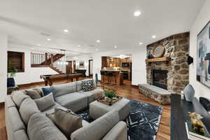 Cozy family/media room with fireplace and kitchen