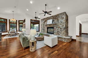 Living area featuring lofted ceiling &  walnut hardwood finished floors