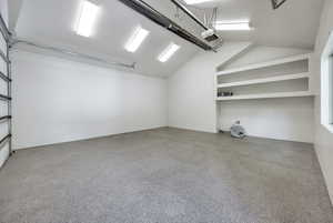 Garage featuring a garage door opener