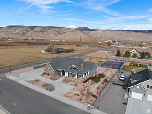 Aerial view of property and surrounding area with mountains