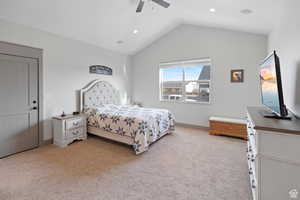 Bedroom featuring light carpet, vaulted ceiling, ceiling fan, and recessed lighting
