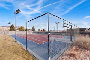 View of sport court featuring a tennis court and community basketball court