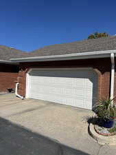 Garage featuring driveway