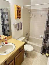 2nd  bath featuring shower / bath combo and vanity