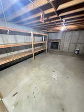 View of unfinished basement behind pocket doors in the Family Room