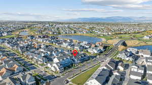 Aerial view of property's location with nearby suburban area and a water and mountain view
