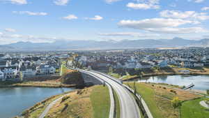 Aerial perspective of suburban area featuring a water and mountain view